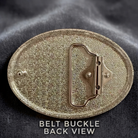 a close-up view of a shiny, metallic belt buckle with a textured surface.