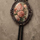 Bohemian bolo tie with pink flowers.