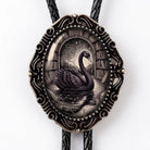 A decorative pendant featuring a black swan swimming in a pond, surrounded by bookshelves and a starry night sky.