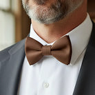 Brown bowtie for men on a groomsman at a wedding.
