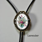 Lavender floral bolo tie with bronze vintage frame and braided leather cord for groom and groomsmen rustic wedding attire.
