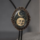 Celestial bolo tie with leather cord.
