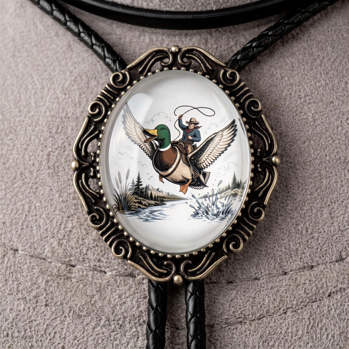 A decorative pendant featuring a detailed illustration of a man riding a duck on a boat, with a scenic landscape in the background.