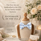The image is an advertisement for handmade bow ties, featuring a mannequin wearing a blue and white floral bow tie, surrounded by wedding decorations and flowers.
