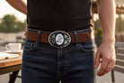Two options for belt buckles: Option 1 has a leaf pattern and option 2 has flowers on it
