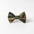 A camouflage bow tie with a dark green and brown pattern.