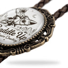 A close-up image of a decorative metal piece with a printed design featuring a cowboy riding a rocket ship.