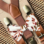 Load image into Gallery viewer, Cognac brown suspenders form a Y-back for men, groomsmen, groom or ring bearer outfit with a terracotta floral bowtie on a white background.
