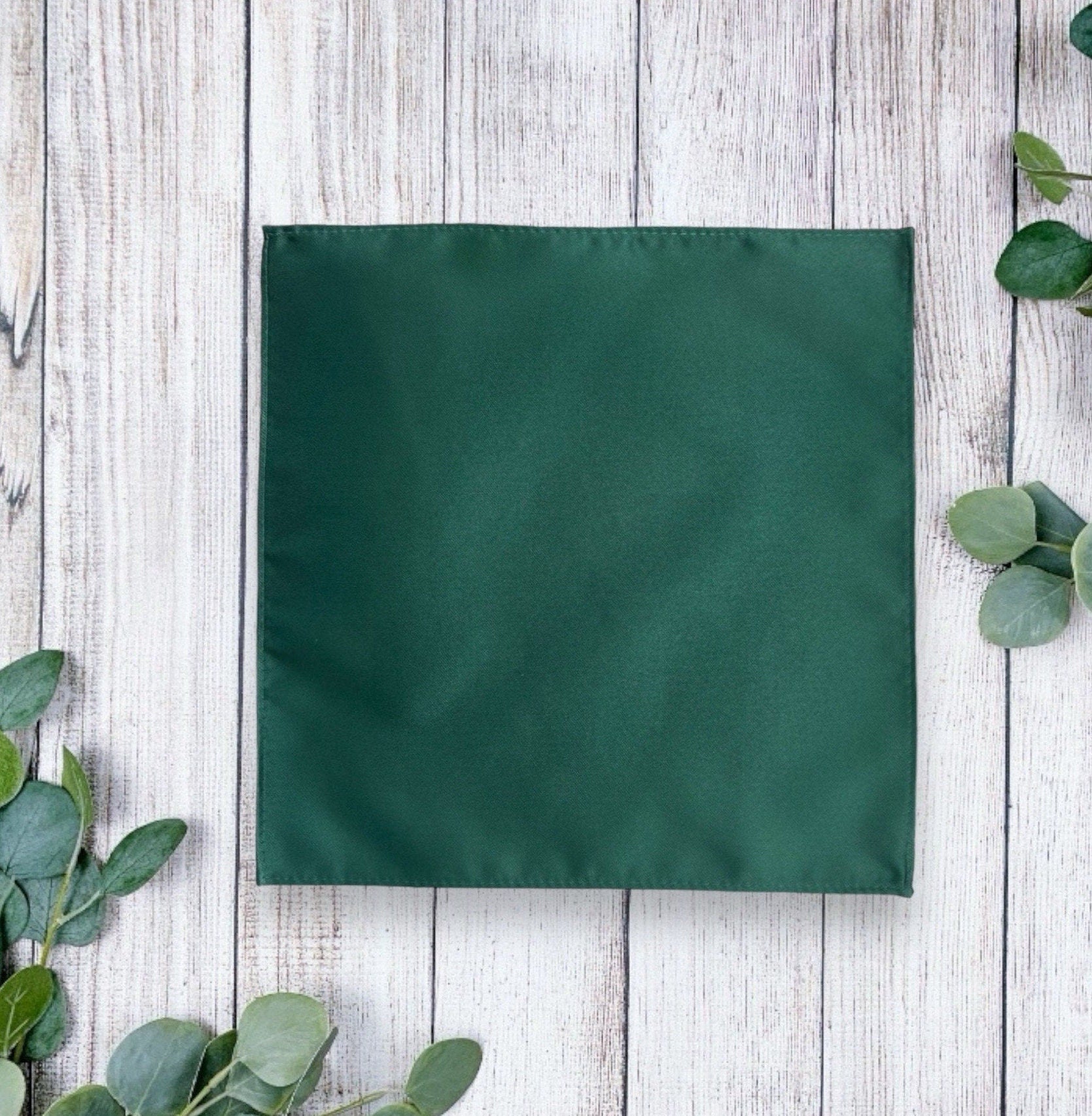 Emerald green pocket square for a wedding.