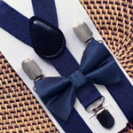 Load image into Gallery viewer, Navy bow tie and navy suspenders for a wedding.
