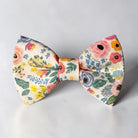 The Bold Bow Tie pre-tied floral cotton bow tie with colorful flowers on a cream background for weddings.