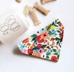Load image into Gallery viewer, a dog bone bone next to a colorful floral napkin
