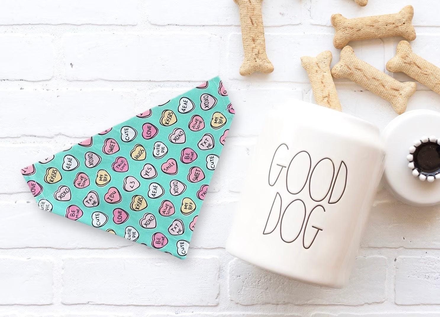 a cup of coffee next to some dog treats