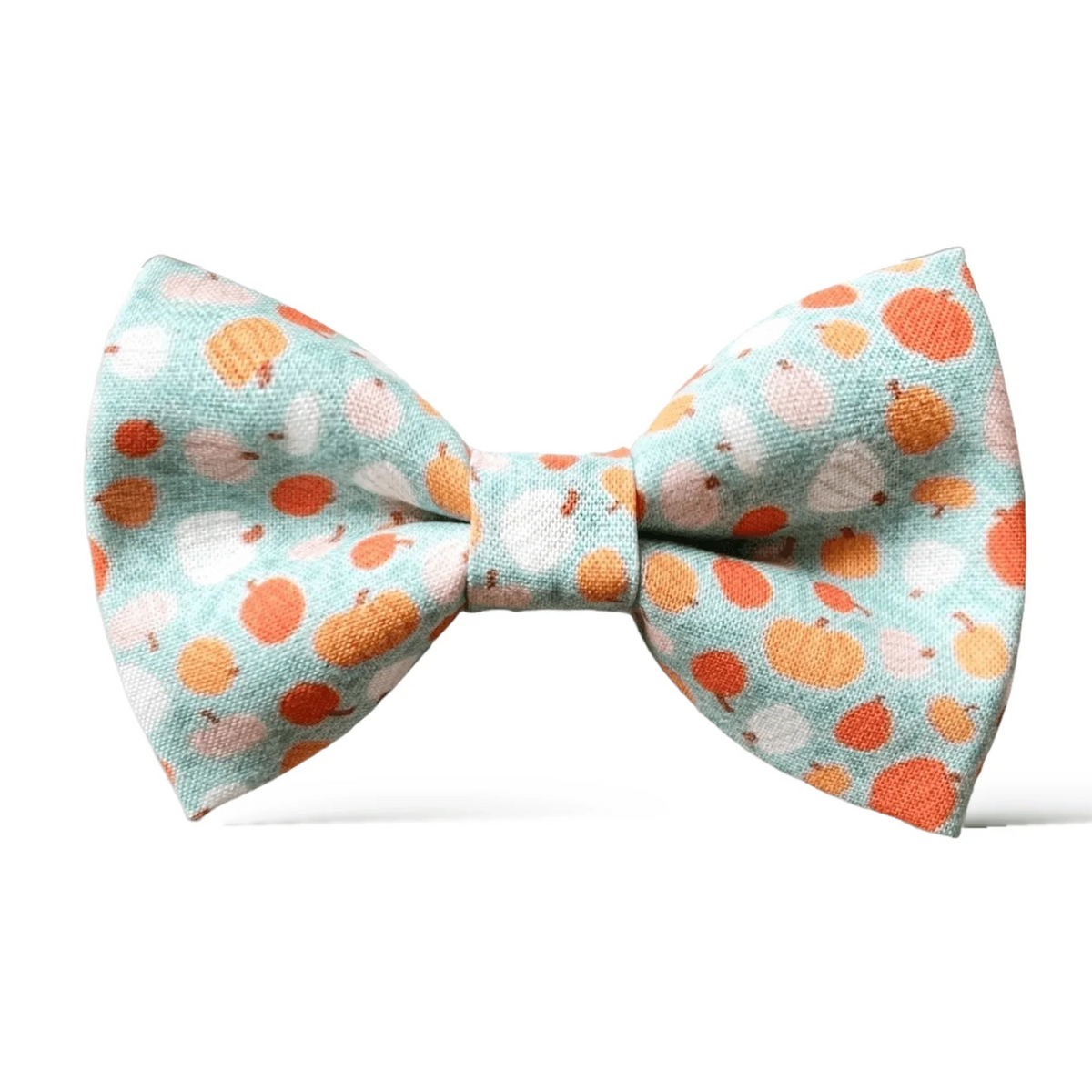 Autumn Bow tie with orange and white pumpkins on a light blue background