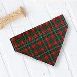 Load image into Gallery viewer, a red and green plaid dog bandana next to a bone bone
