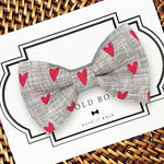 Load image into Gallery viewer, a bow tie that has hearts on it
