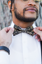 Load image into Gallery viewer, Black &amp; Gold Floral Bow Tie
