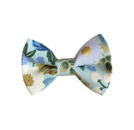 Load image into Gallery viewer, a bow tie with a flower pattern on it

