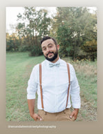 Load image into Gallery viewer, Groom waiting for his bride in brown vegan leather suspenders and sage floral bow tie.
