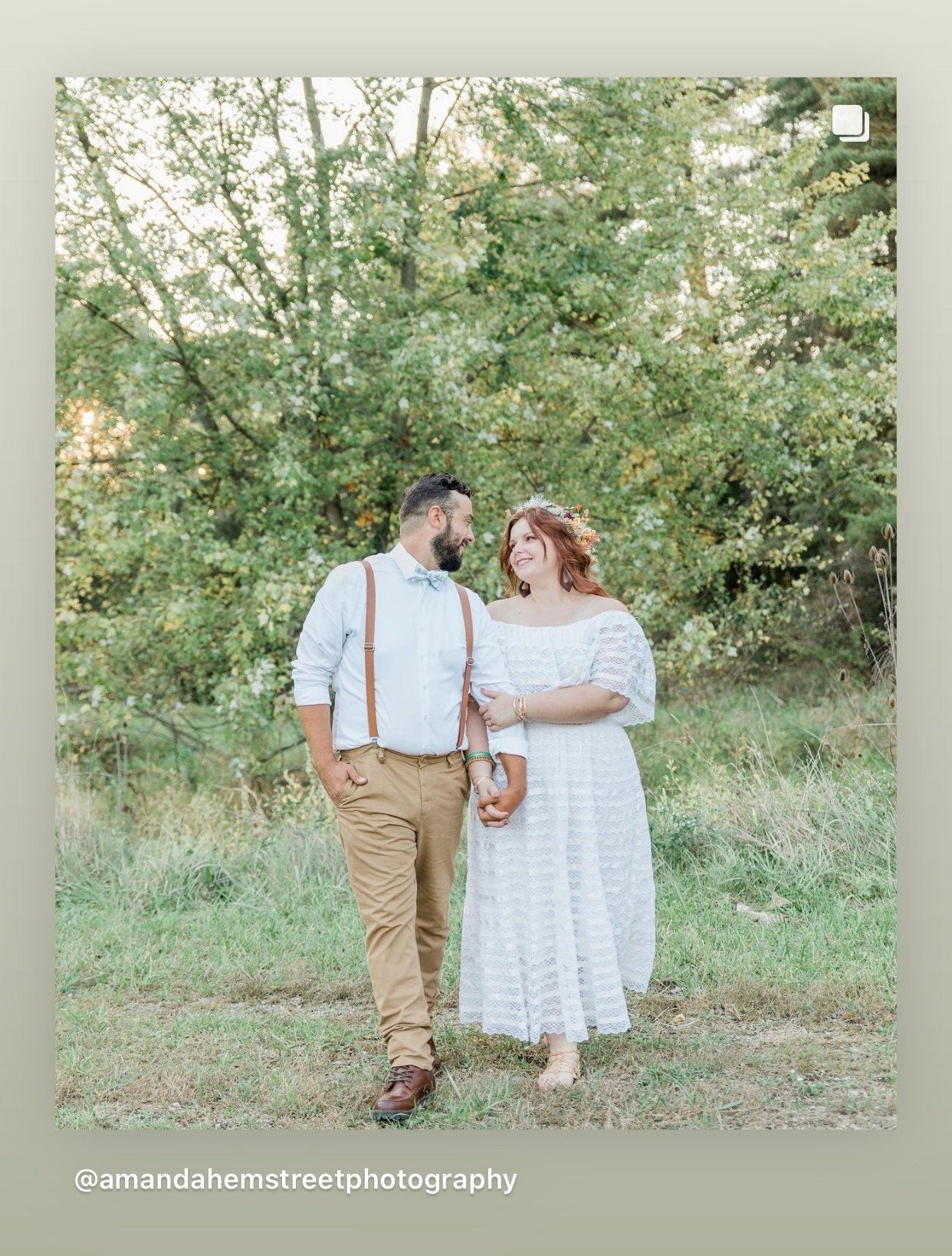 Bride & Groom at their wedding with the groom wearing brown vegan leather suspenders and sage floral bow tie